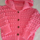 Pink hooded cardigan for a young girl ages two and a half 