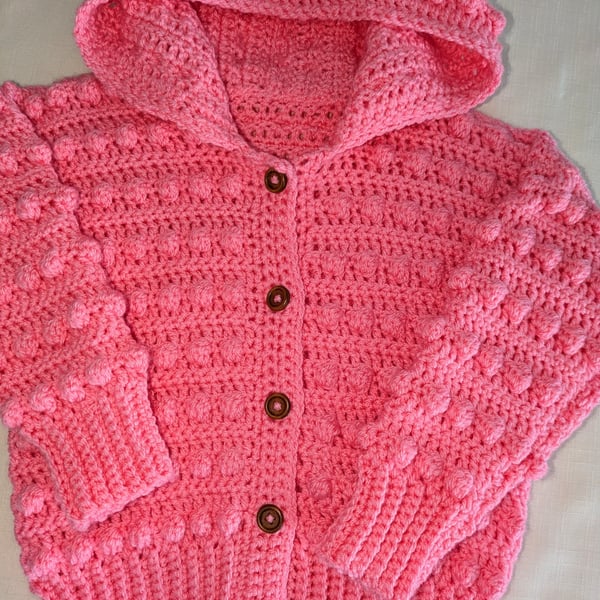 Pink hooded cardigan for a young girl ages two and a half 