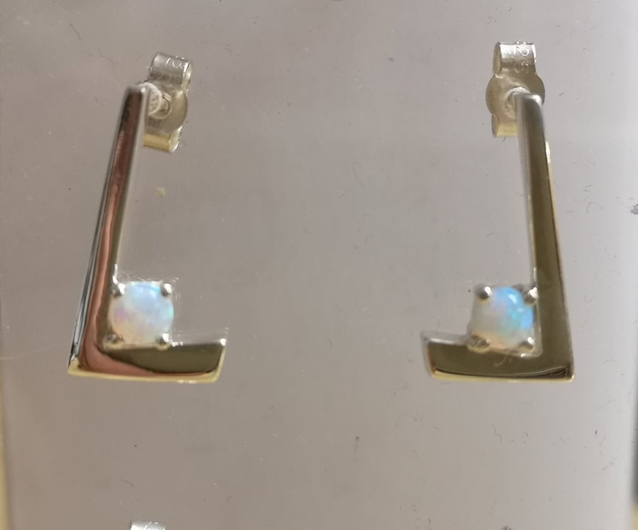 TickTock studs made from Silver set with an Opal