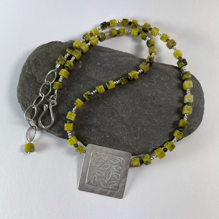 Sterling silver and olive jade necklace with embossed leaf pattern