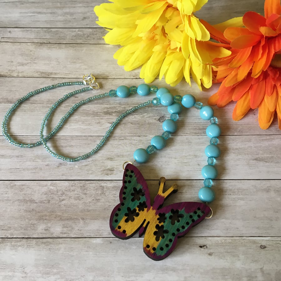 Wooden butterfly with turquoise beads charming necklace. 