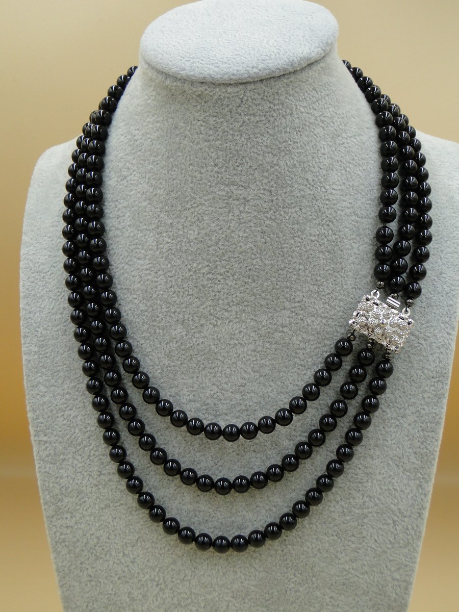 Elegant multi row Mystic black pearl necklace with sterling clasp.