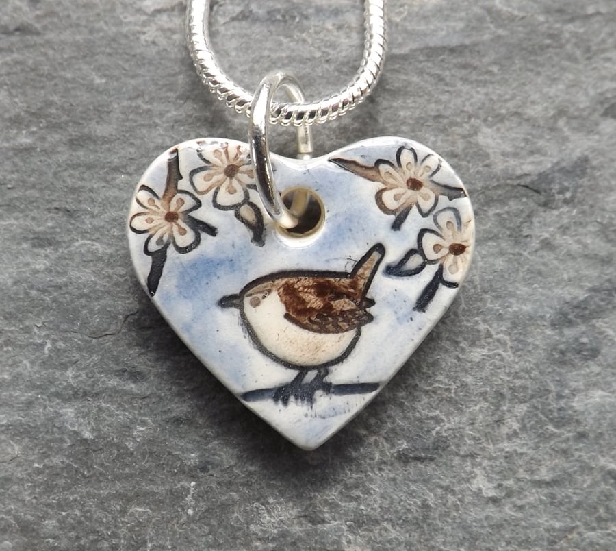 Heart shaped handmade ceramic Wren in the Blackthorn pendant in pale blue
