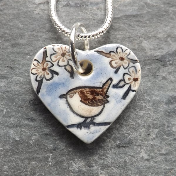 Heart shaped handmade ceramic Wren in the Blackthorn pendant in pale blue