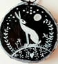 white hare on wood slice black background - Image 1