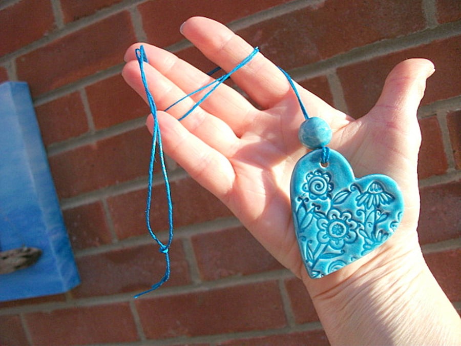 SALE - Large Turquoise Heart with a bead impressed with a floral design