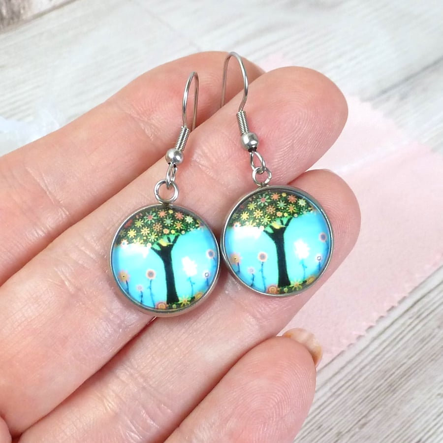 Bright blue sky and tree earrings with blossom and sunflowers. Dangle earrings