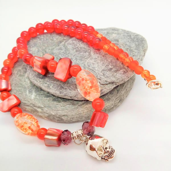 Silver Skull Pendant on an Orange Red Purple & Pink Shell Beaded Necklace