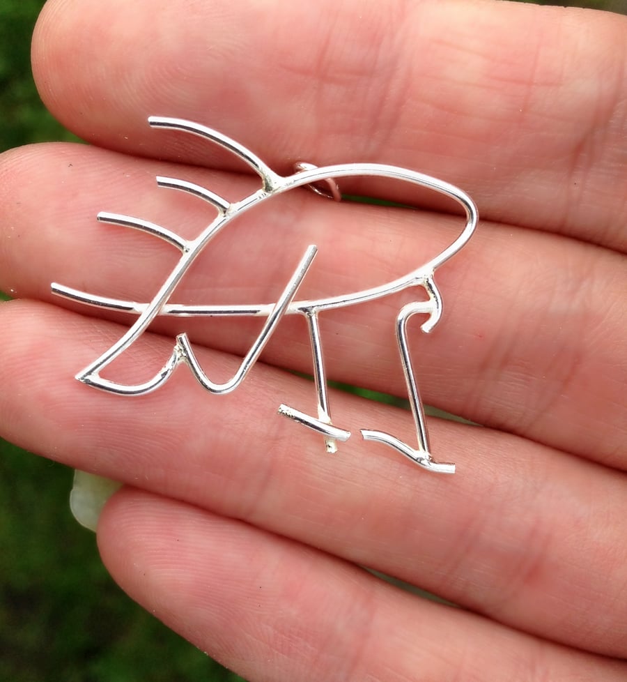 A childs chalk drawing transformed into a personalised bespoke pendant