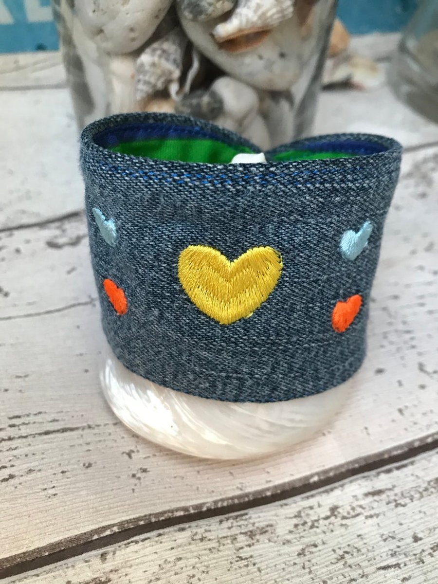 Embroidered denim cuff bracelet with hearts