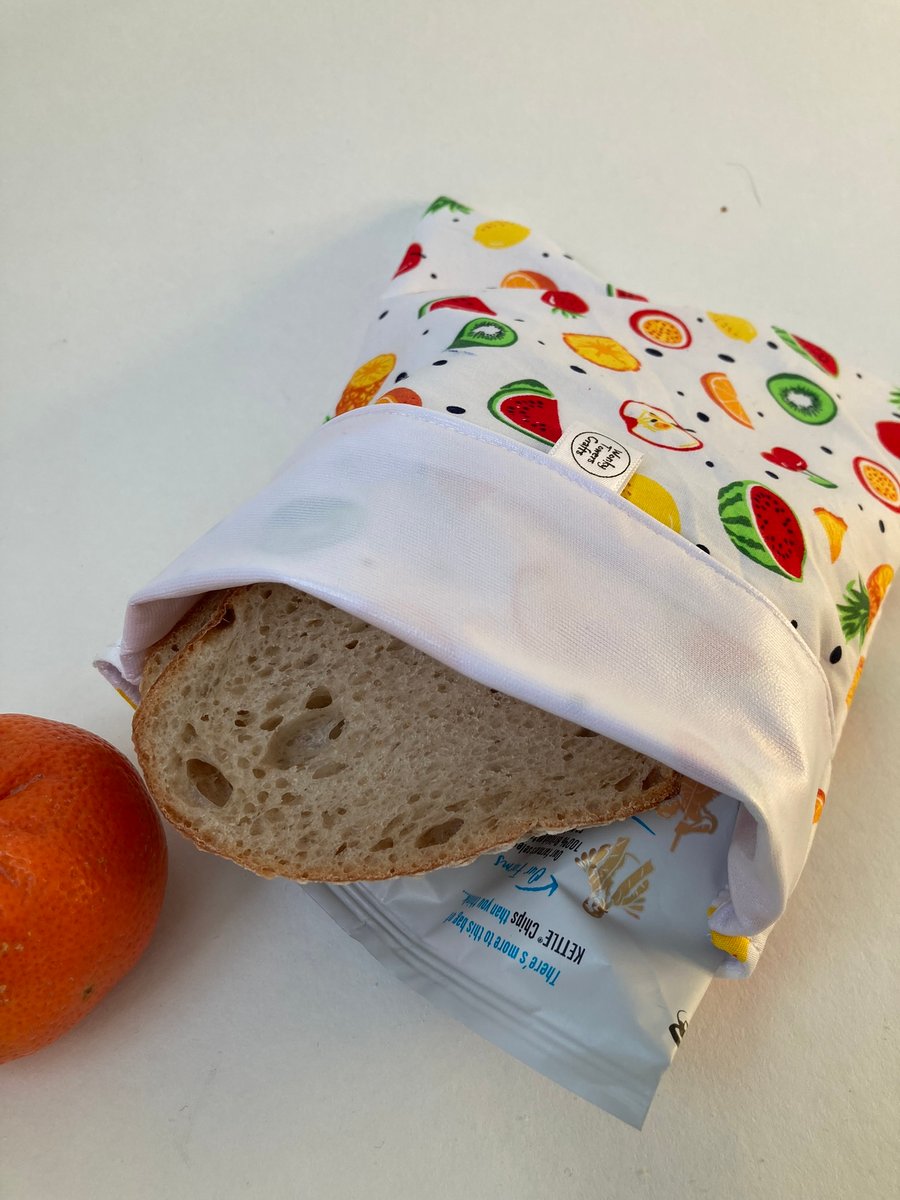 Large, reusable, eco-friendly sandwich bag in fruity fabric with PUL lining.