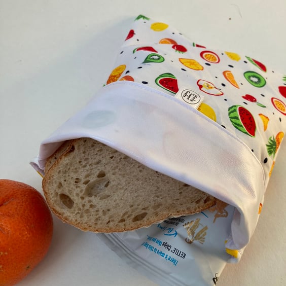 Large, reusable, eco-friendly sandwich bag in fruity fabric with PUL lining.