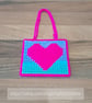 Wall art of a bright pink heart, adjustable hang length