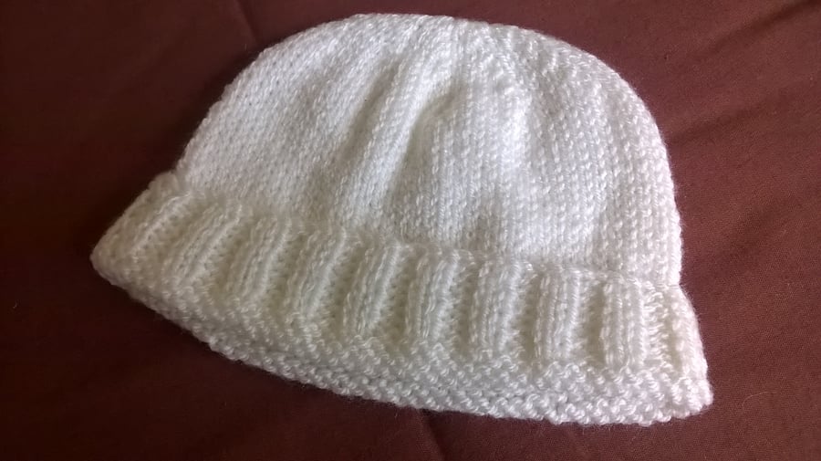 A Baby Boys Cream Pullon Hat with Turned Back Rim