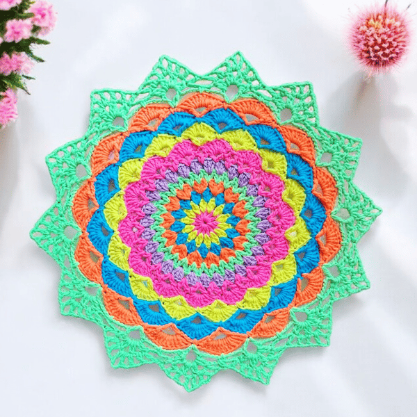 Large, bright crochet mandala doily table mat