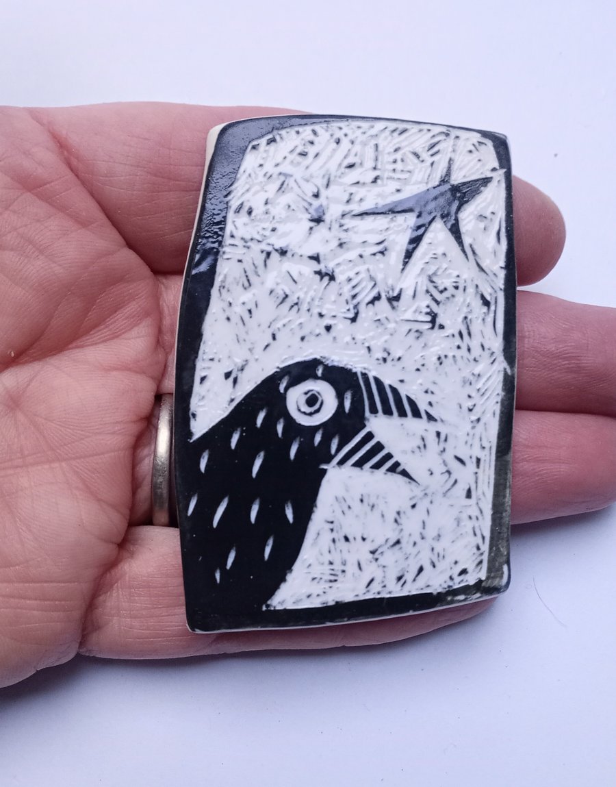 Porcelain crow brooch