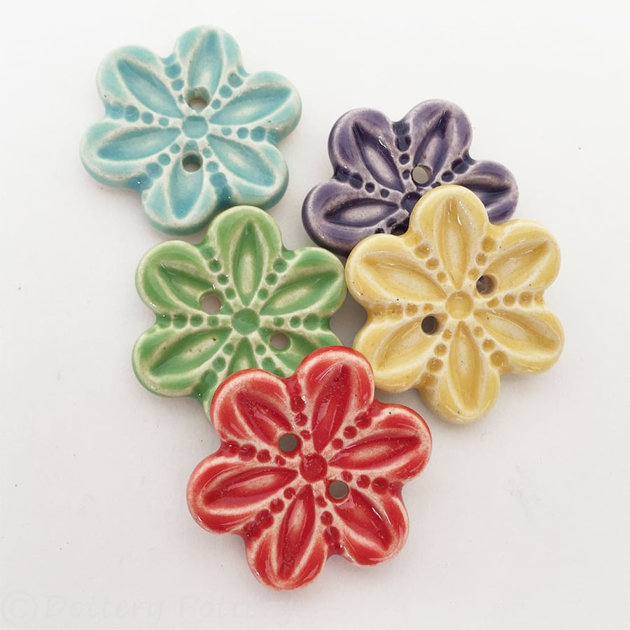 Set of five flower shaped ceramic handmade buttons