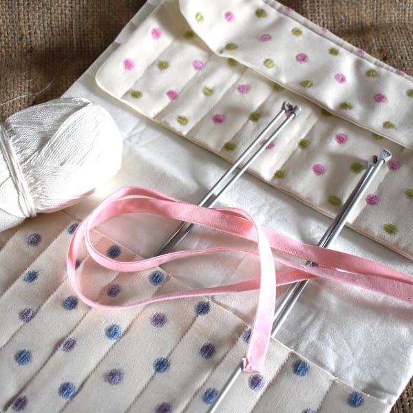 Fabric storage roll for knitting needles and crochet hooks. Ideal gift.