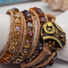 Bronze-orange leather triple wrap bracelet with abstract clasp