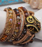 Bronze-orange leather triple wrap bracelet with abstract clasp