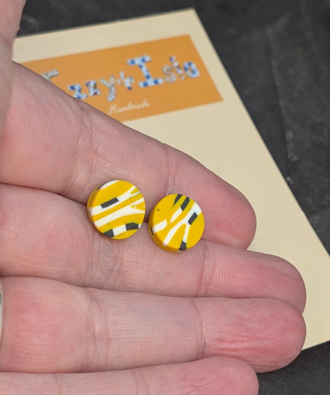 Artisan studs, small with abstract design, mustard with black and white.