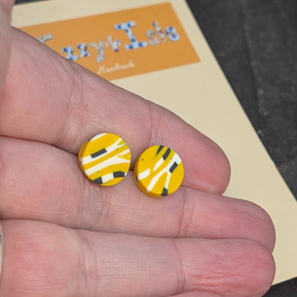 Artisan studs, small with abstract design, mustard with black and white.