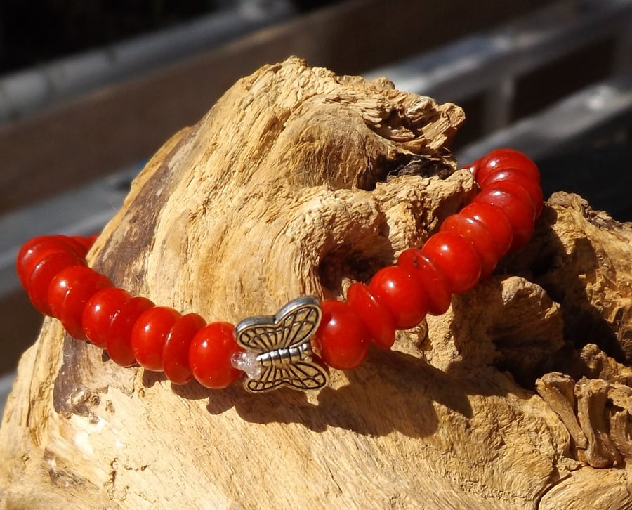 Red Coral stretch bracelet with silver butterfly charm