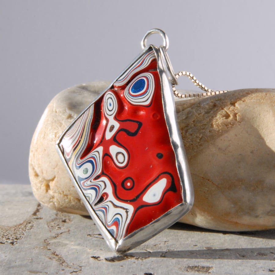 Reversible red fordite and sterling silver pendant