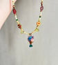 Vintage-Inspired Floral Vase Pendant and Multicolour Beaded Necklace - Image 4