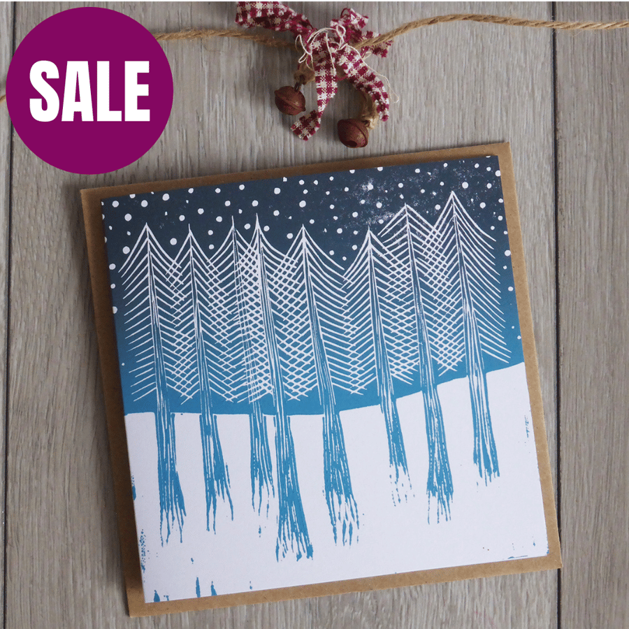 Christmas trees in snow Christmas card, handprinted from a linocut