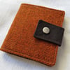 Slight second: Harris Tweed bifold wallet in burnt orange