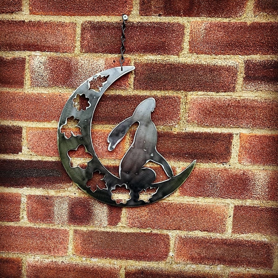 Hare sitting on a crescent Moon . Metal Garden, Patio and Home Decoration.  