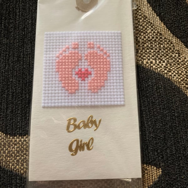 Cross stitched baby girl feet gift tag