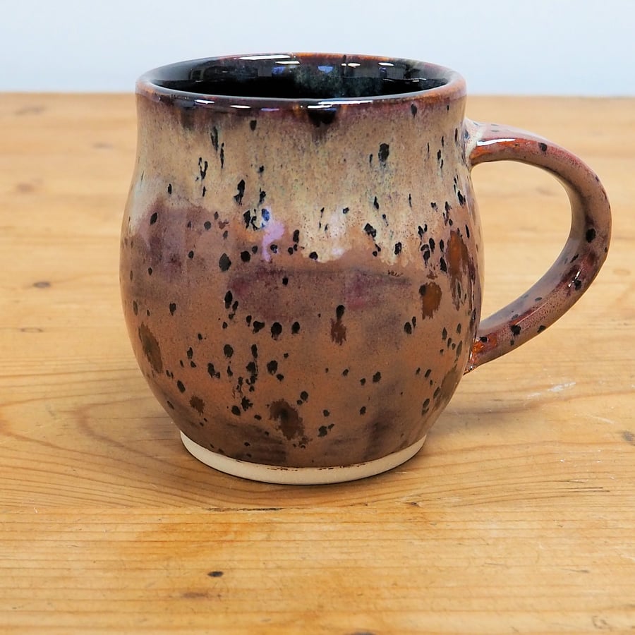 Large pottery mug finished in multi-coloured purple plum glaze, handmade