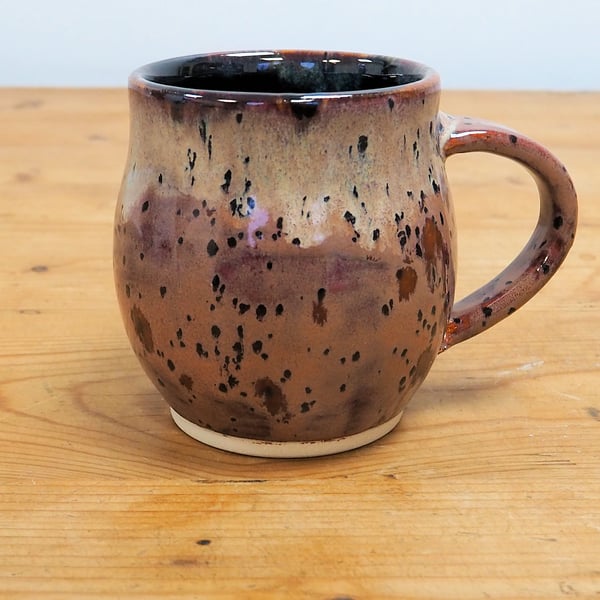 Large pottery mug finished in multi-coloured purple plum glaze, handmade