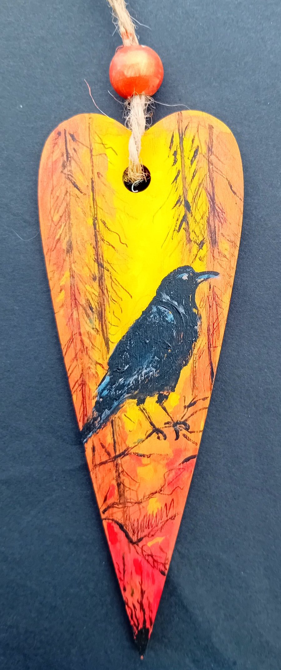 Raven in a forest heart shape