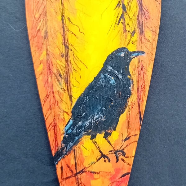 Raven in a forest heart shape