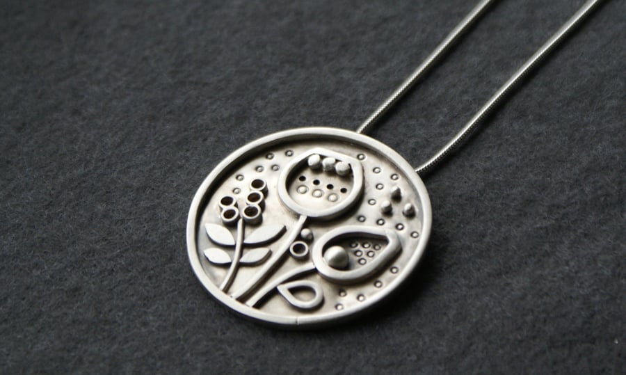 Seeds and pods statement silver pendant 