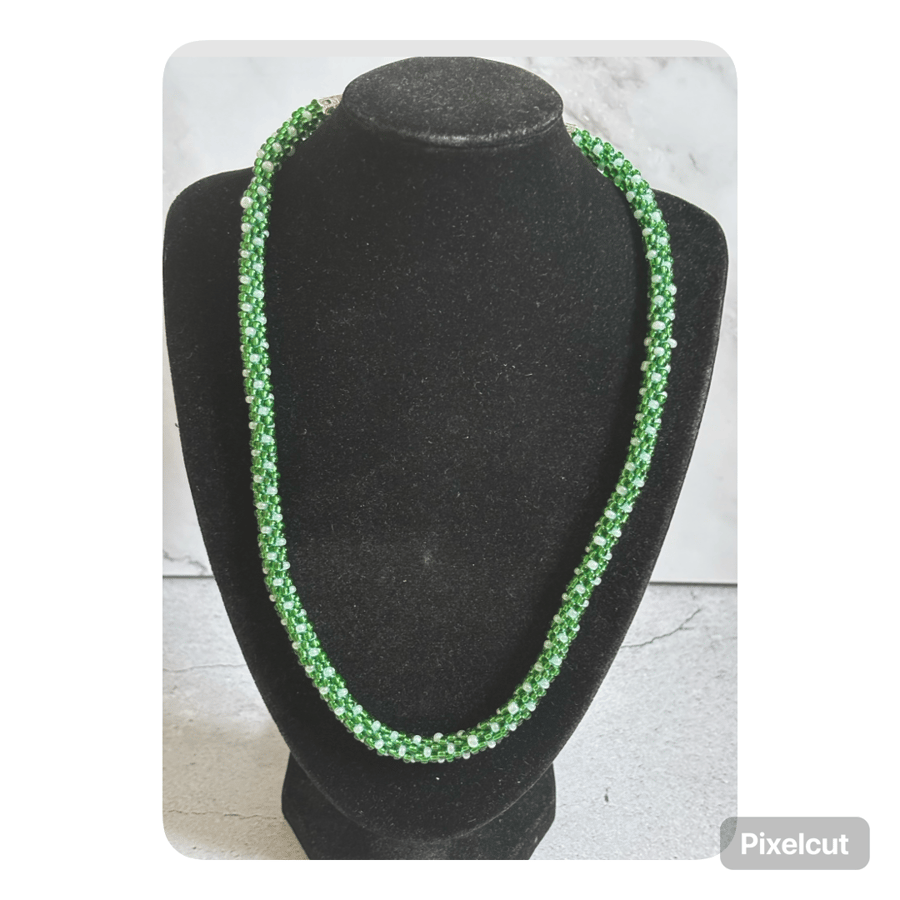Green and white polka dot beaded kumihimo necklace