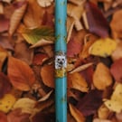 Beautiful hedgehog candle in blue green