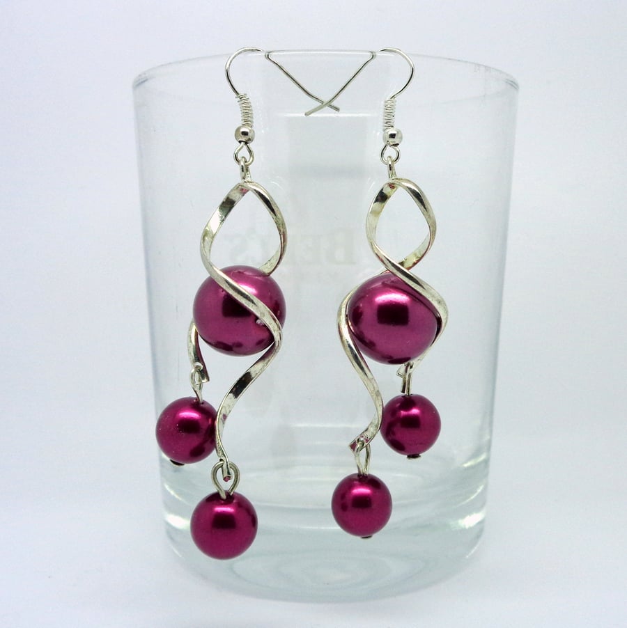 Dark pink glass pearl twisted drop earrings 
