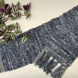 Hand spun Knitted scarf made with a mix of blended fibres.