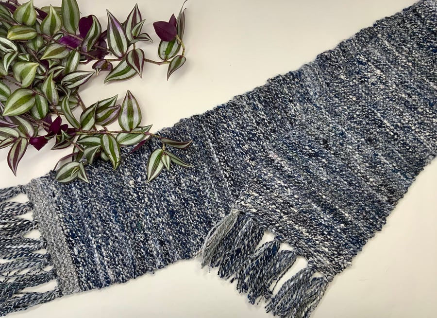 Hand spun Knitted scarf made with a mix of blended fibres.