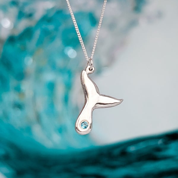 Fluke - Sterling Silver whale tail pendant with pale ocean blue stone