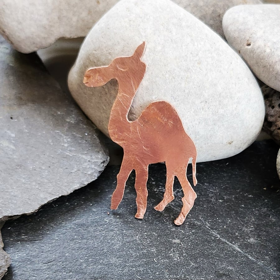 Camel brooch in copper