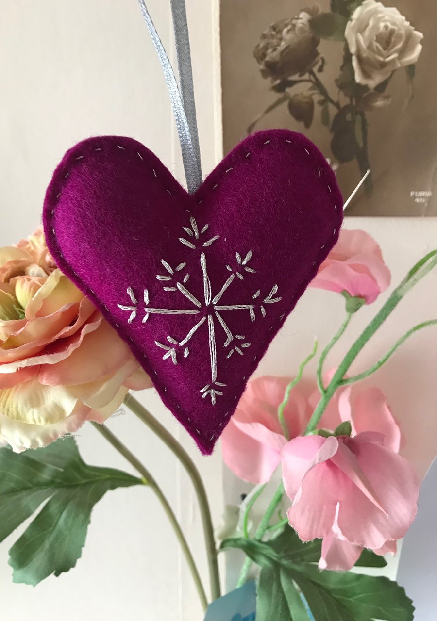  Hand embroidered heart, in cerise felt with silver stitching.