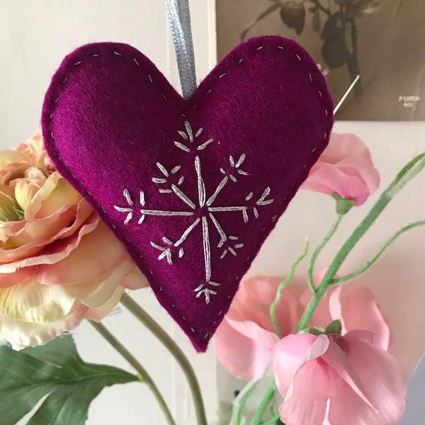  Hand embroidered heart, in cerise felt with silver stitching.