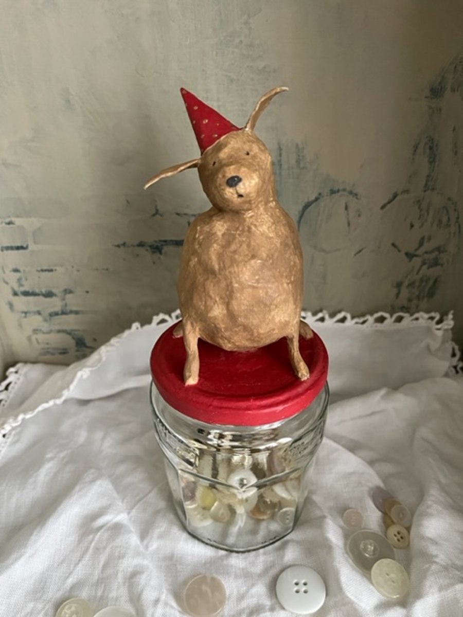 Paper mache dog on glass jar