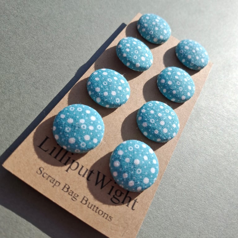 Set of eight scrap bag buttons - teal cotton fabric with white dots and circles 