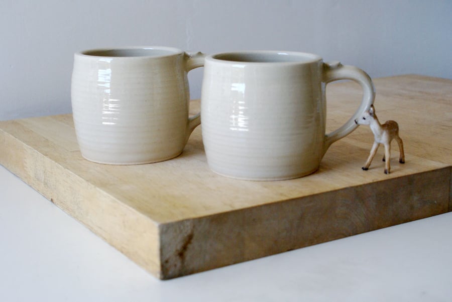 Two tankard style stoneware pottery tea mugs - glazed in simply clay